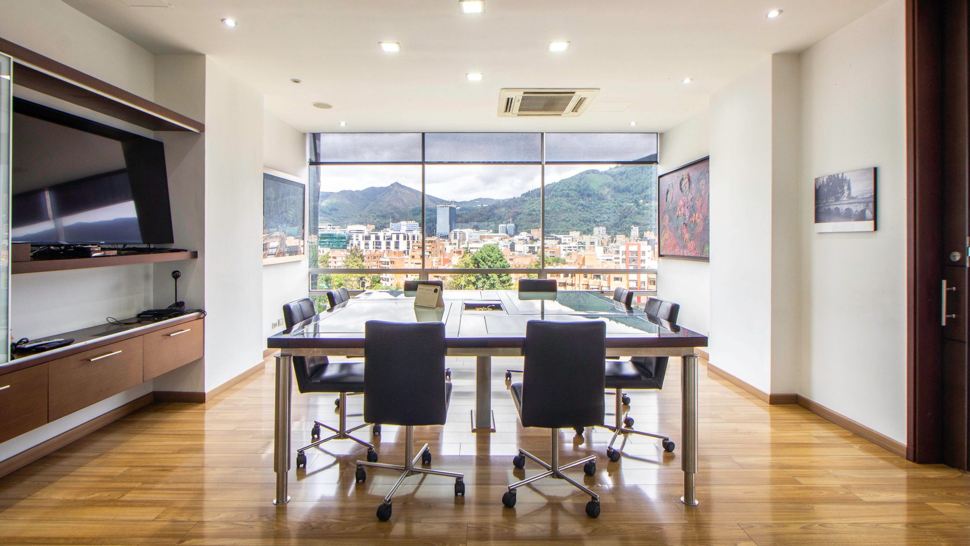 A modern meeting room overlooking a city